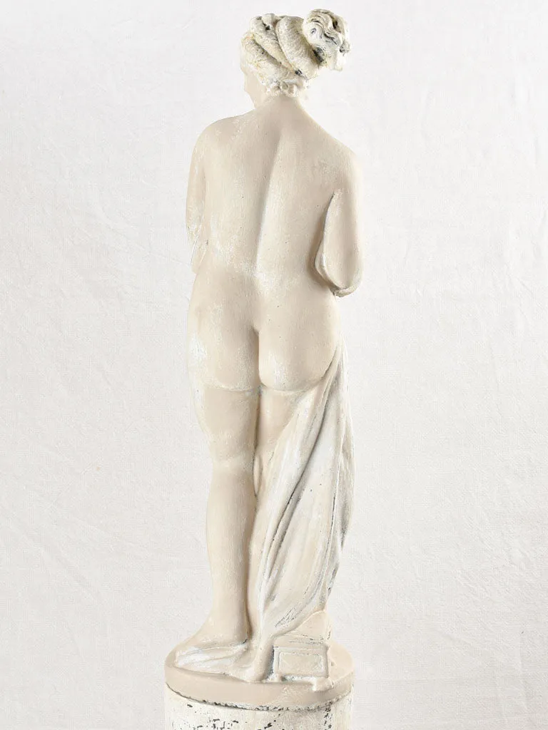 Art Deco style figurative statue on pedestal